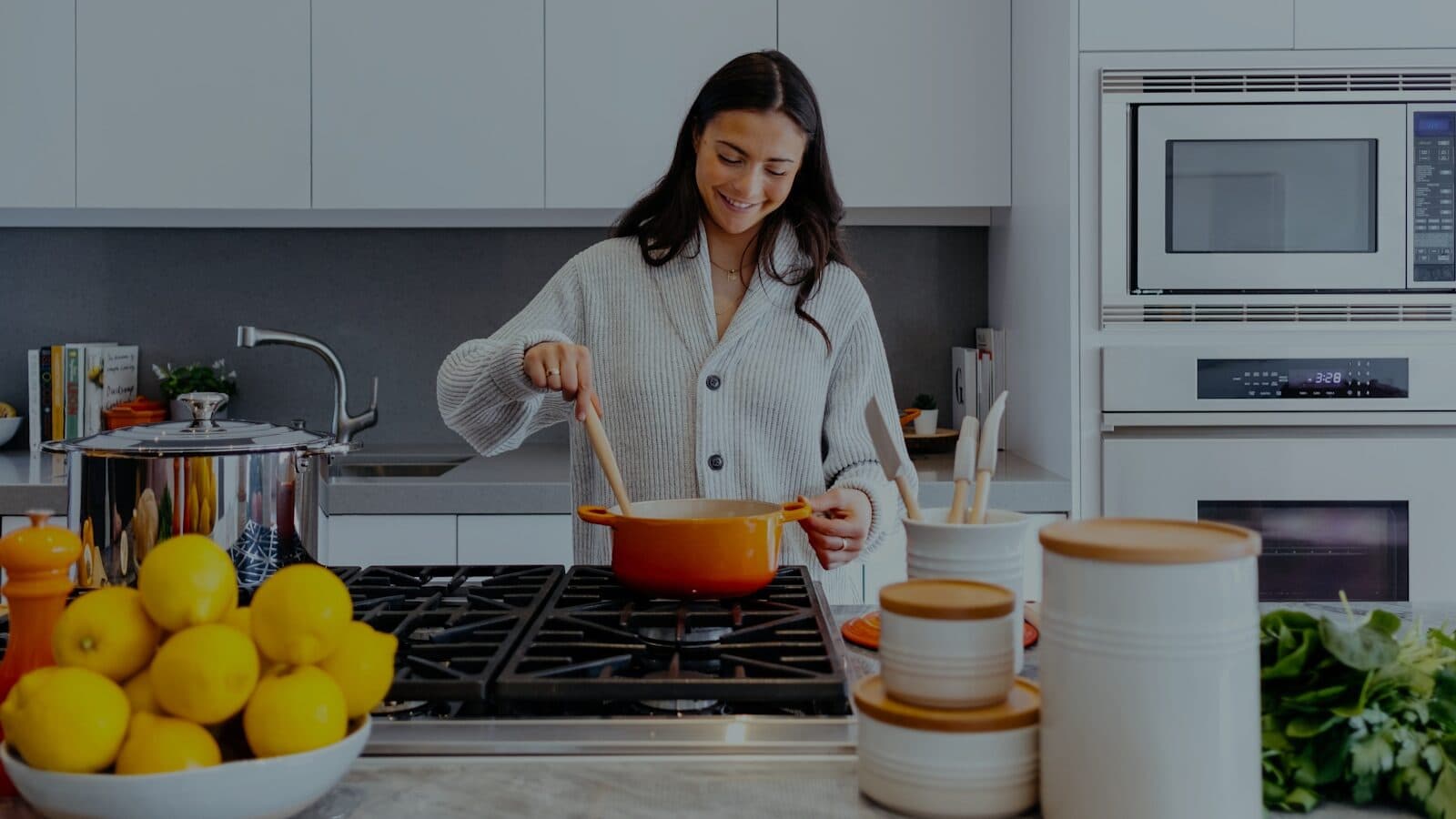 A sample kitchen frame standing in for a cooking stream: one cook at the stove, one locked-off camera
